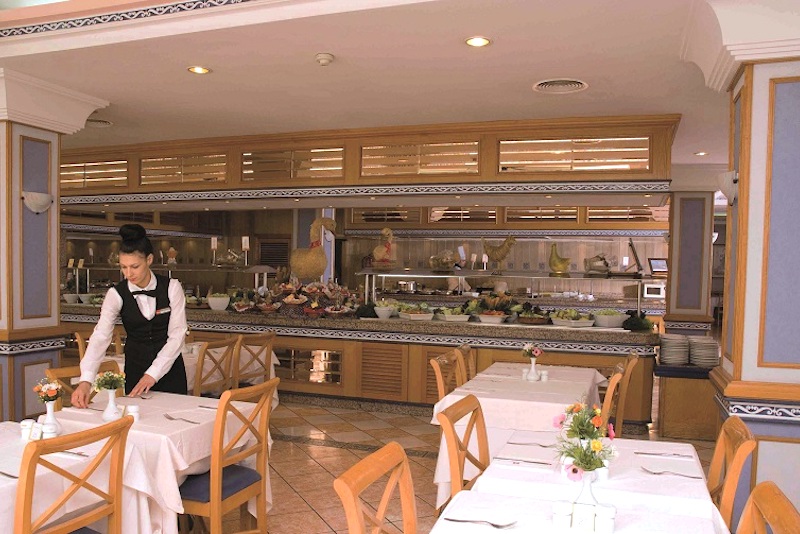 Preparation of the buffet service in the old restaurant of the hotel Riu Playa Park 
