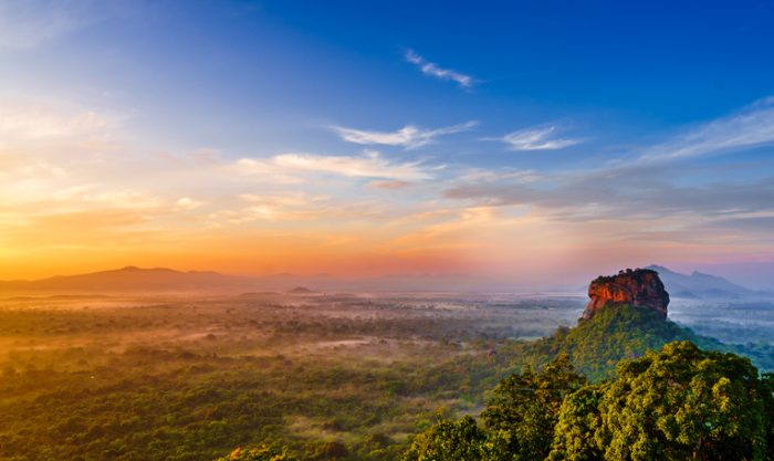 Photo of Sigiriya Rock towering above the Sri Lanka 