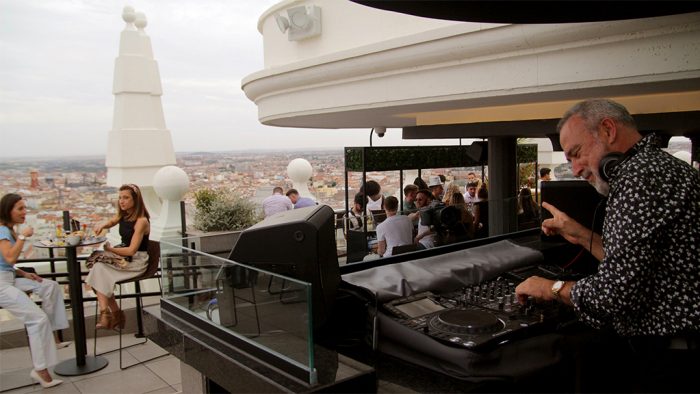 Luis Riu, playing music in his DJ set at the terrace of the Riu Hotel Plaza España in Madrid.