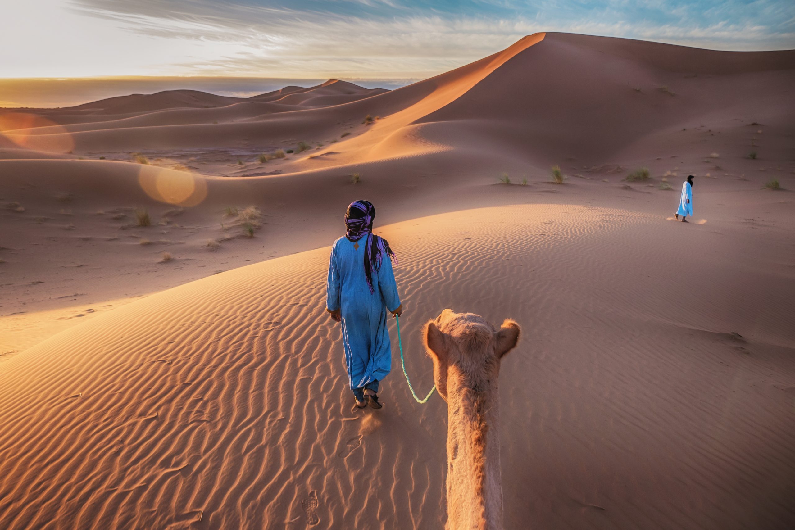 Showing The Traditional Blue Clothing And Mode Of Transportation Of Nomadic Tuareg Tribesmen In