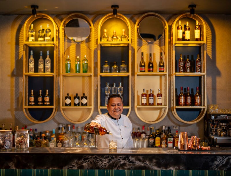 A bartender is serving a drink at the Elite Club bar at the hotel Riu Palace Pacifico in Riviera Nayarit, Mexico.