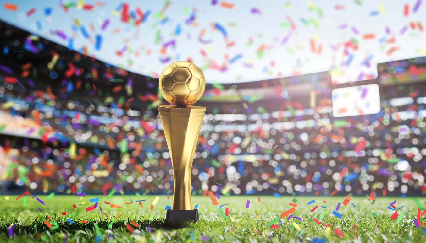 Image of the World Cup Trophy in a football stadium