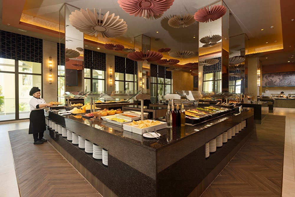 An image showcasing various dishes at the main restaurant buffet at Riu Palace Aruba.