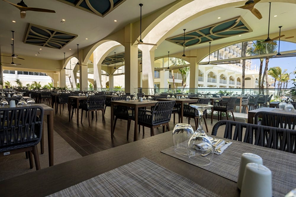 Outdoor view of the main restaurant terrace at Riu Palace Aruba.