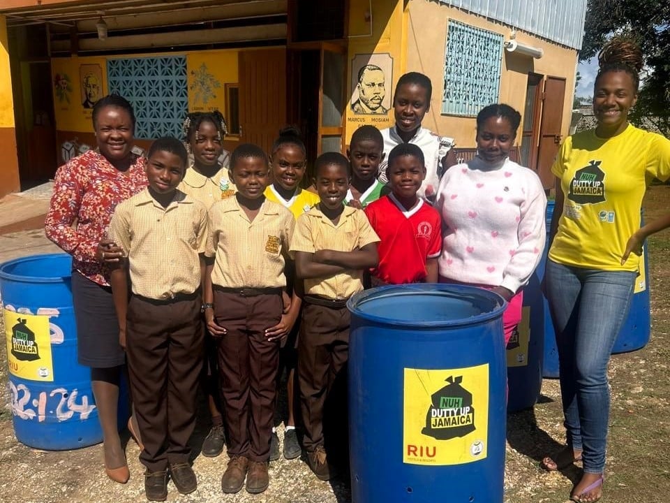group people smaily and standing with recycled bins