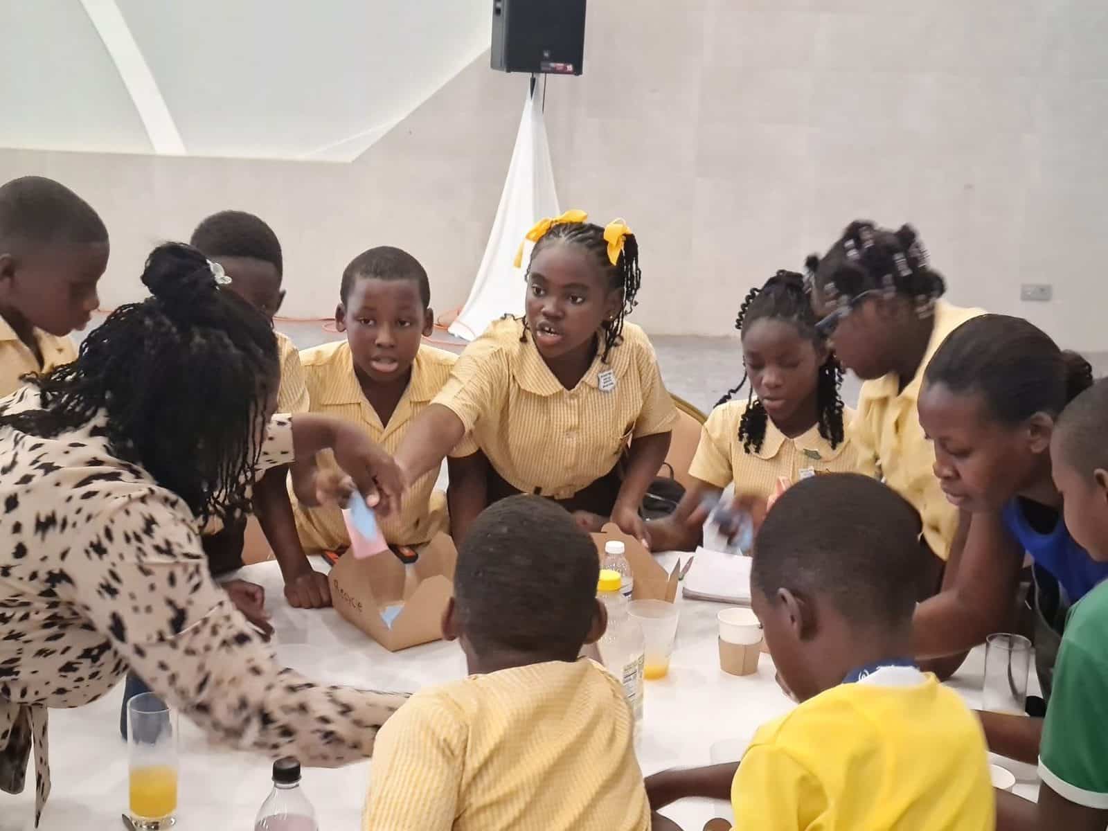 a group of children is learning about recycling